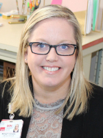 Photo of blonde woman with glasses