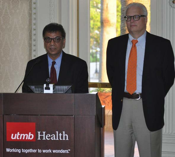 Drs. Anish Bhardwaj and Allen Ropper at podium 