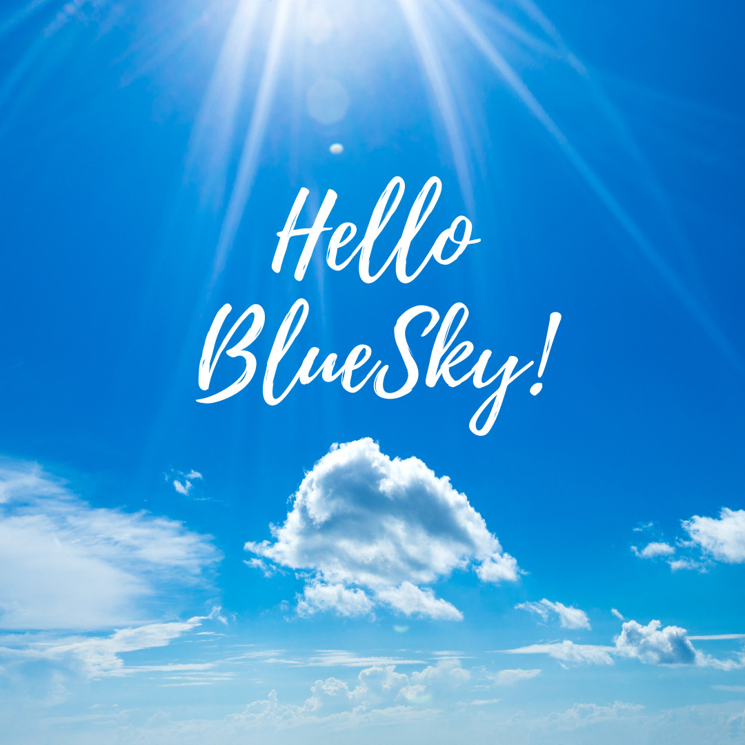 Hello Bluesky! Stylized handwritten text against a bright blue sky with wispy clouds and sun rays shining down from above