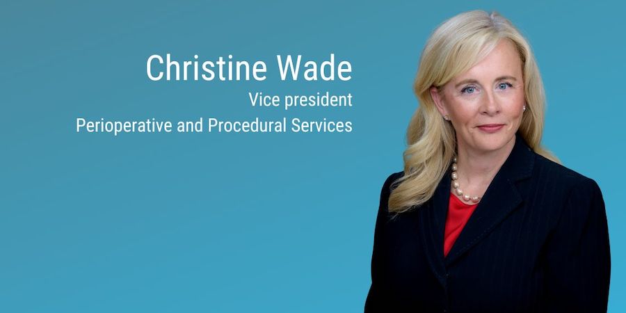 text on image states "Christine Wade vice President Perioperative and Procedural Services" the background is a gradient blue and the female headshot is of a blonde woman with shoulder length hair wearing a black blazer over a red shirt