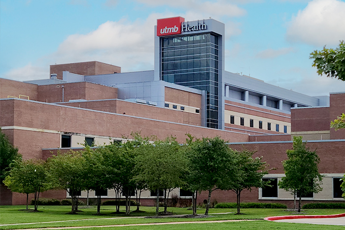 league-city-campus Exterior view of a UTMB Health medical center building with landscaped grounds.