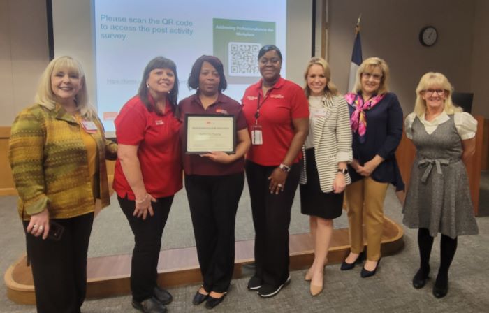 Katherine Thomas (center) received recognition