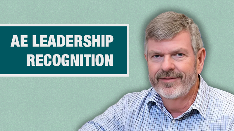 A light teal banner with Dr. Weaver's photo on the right and the words "AE Leadership Recognition"